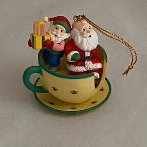 Vintage Ornament Santa clauses sitting in Disneyland Mad -Tea-party